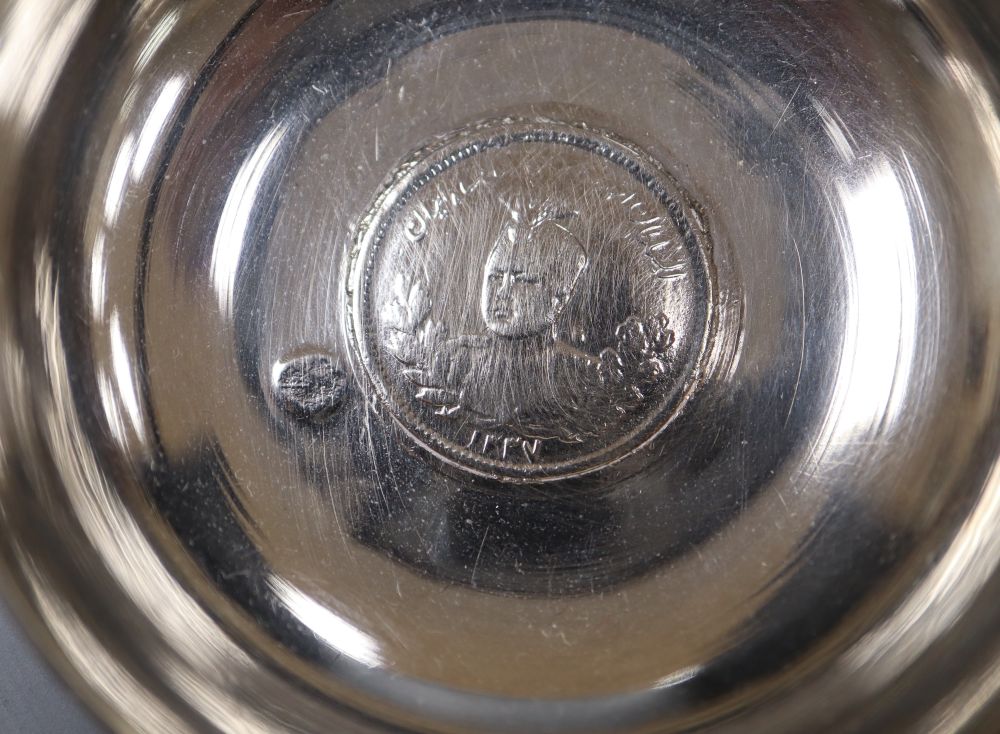 A small Persian white metal dish with inset coin, 67mm, a sterling small vase and a modern silver photograph frame.